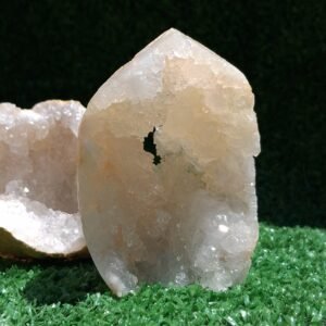 Side view of wholesale cut base natural geode crystal tower specimen